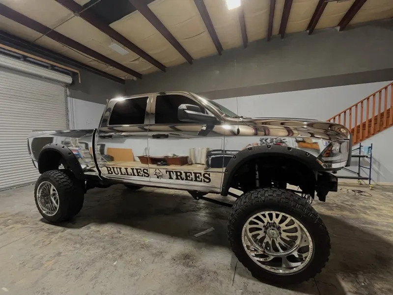 Bullies Trees branding on a lifted chrome pickup truck