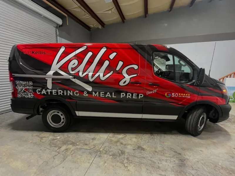 Kelli's Catering red and black wrapped delivery van
