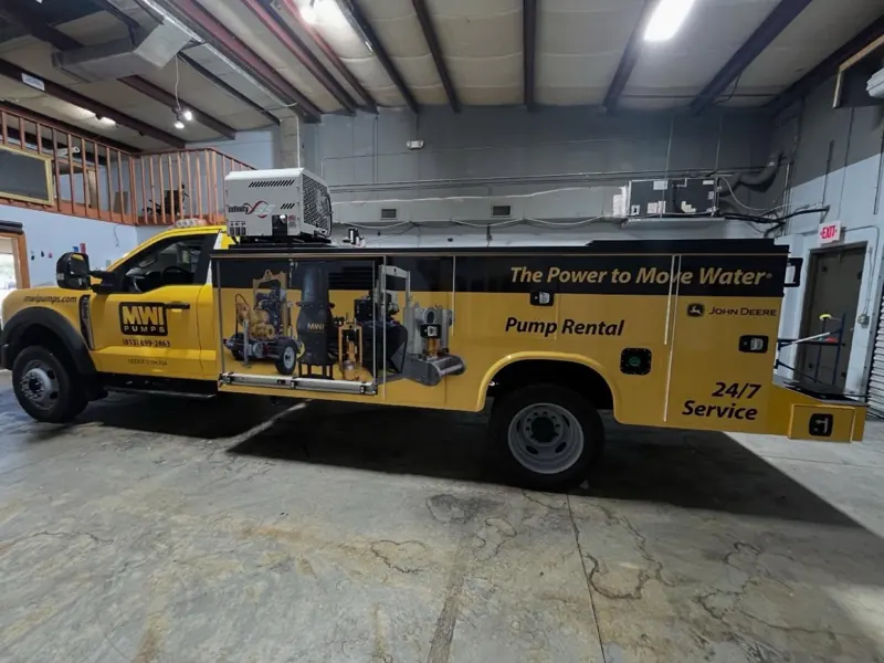 Yellow MWI Pumps service truck with pump rental and 24/7 service graphics